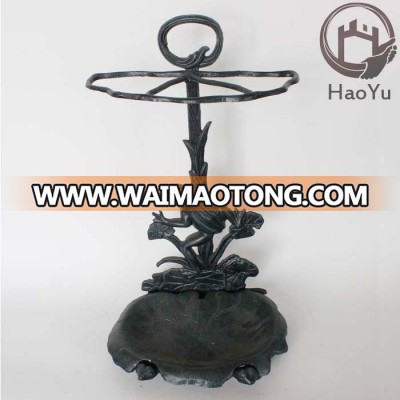 wrought iron umbrella stand with frog decoration